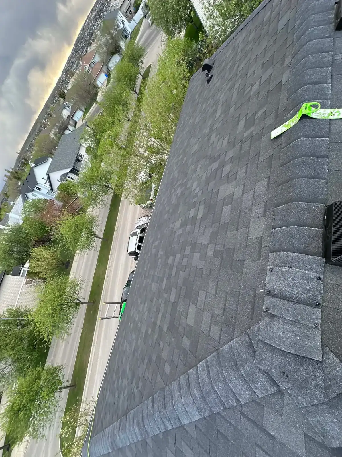 Ridge cap shingle installation on a Calgary roof