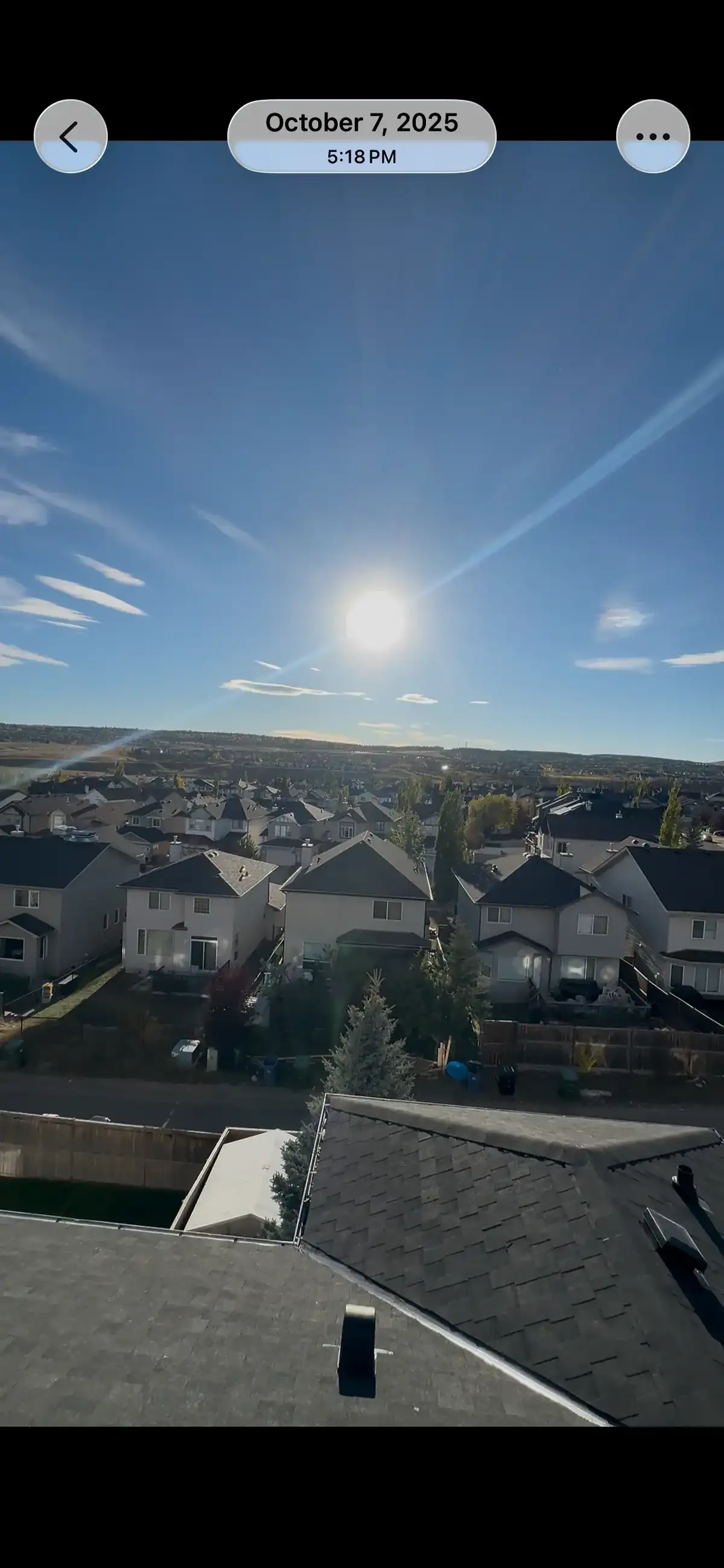 Aerial shingle roof inspection over a Calgary neighborhood